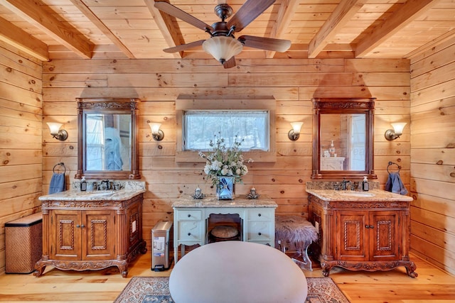 full bathroom with wooden ceiling, a sink, and beamed ceiling