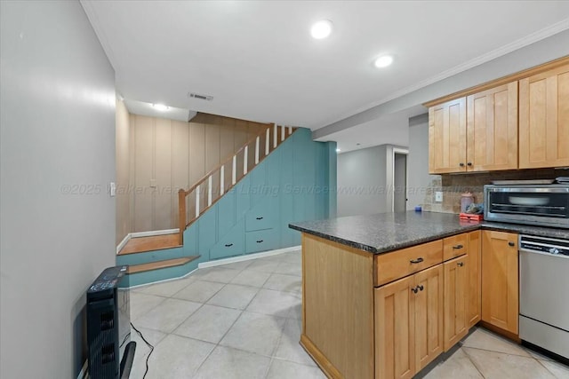 kitchen with decorative backsplash, visible vents, a toaster, a peninsula, and stainless steel dishwasher