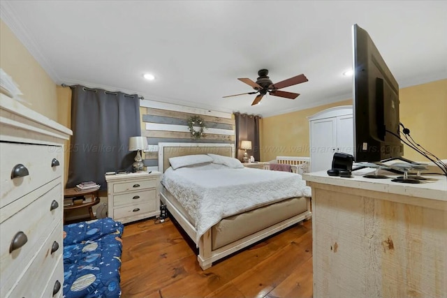 bedroom featuring a ceiling fan, wood finished floors, recessed lighting, and crown molding