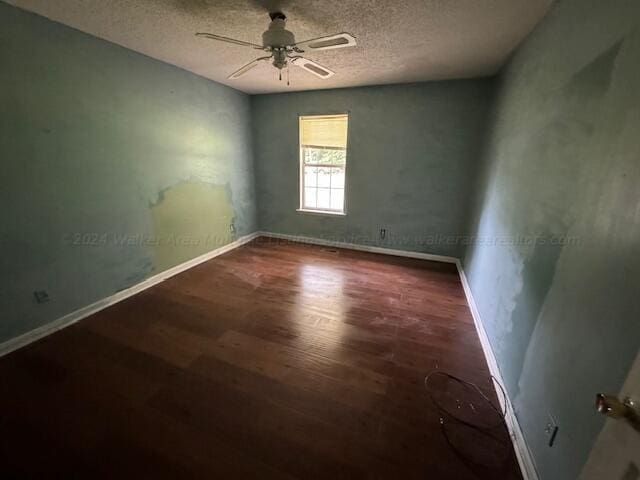 151 Bassmen Dr, Parrish, AL 35580 - empty room featuring wood finished floors, baseboards, a textured ceiling, and a ceiling fan
