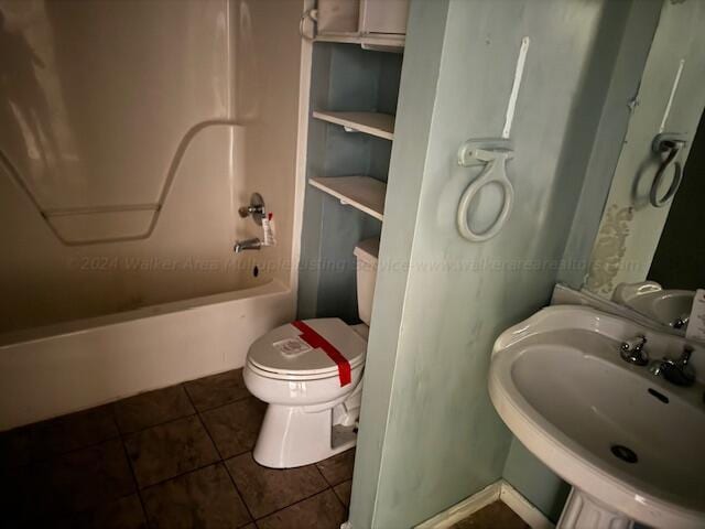 151 Bassmen Dr, Parrish, AL 35580 - bathroom featuring tile patterned floors, a sink, shower / tub combination, and toilet
