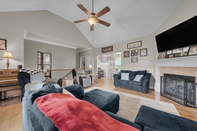 7442 Cresview Ln, Dora, AL 35062 - living room with ceiling fan, high vaulted ceiling, a tile fireplace, and wood finished floors