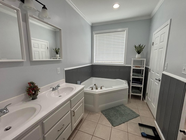 bathroom with tile patterned flooring, a sink, a bath, and ornamental molding