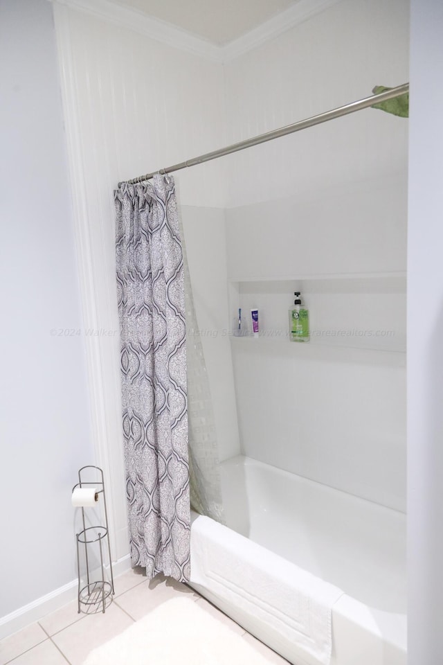 bathroom with crown molding, tile patterned floors, and shower / bath combo