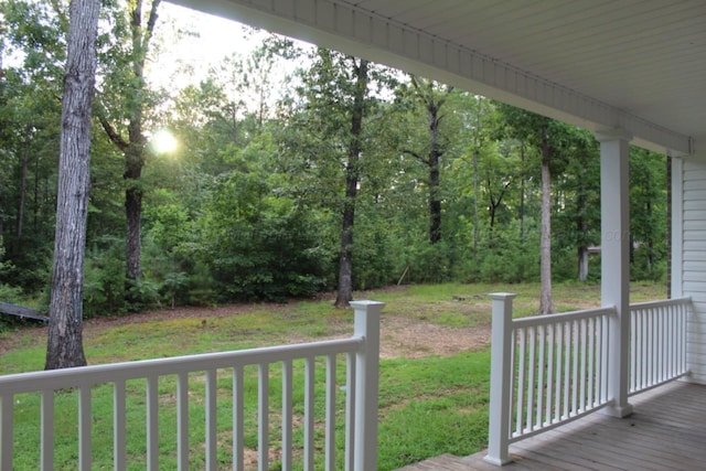 381 Gray Cir, Winfield, AL 35594 - wooden porch with a lawn