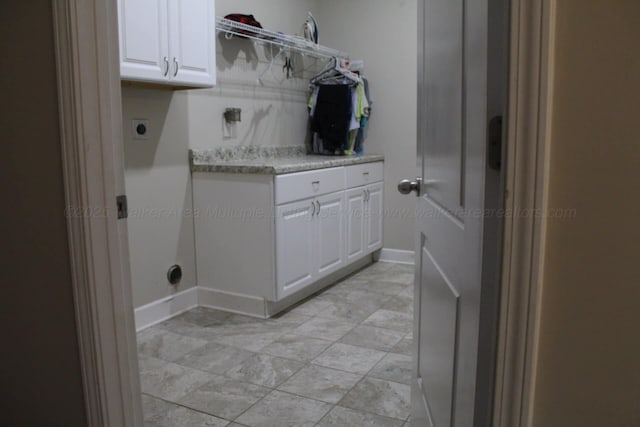 381 Gray Cir, Winfield, AL 35594 - laundry room featuring cabinet space and hookup for an electric dryer