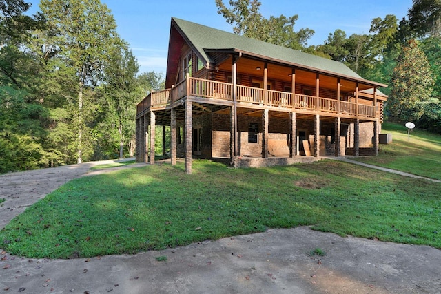 exterior space with a wooden deck and a front yard