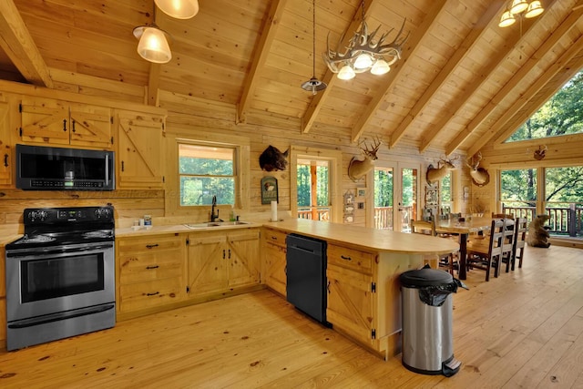 kitchen with kitchen peninsula, a wealth of natural light, sink, black appliances, and light hardwood / wood-style flooring