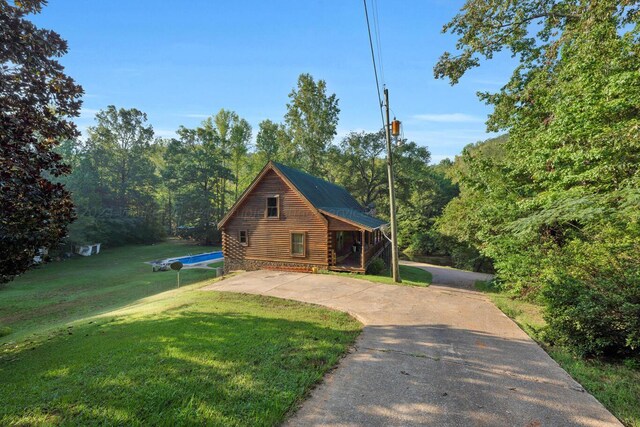 log home with a front yard