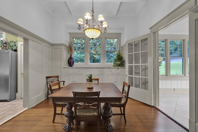 1600 Birmingham Ave, Jasper, AL 35501 - dining area featuring a chandelier, wood finished floors, beamed ceiling, coffered ceiling, and a decorative wall