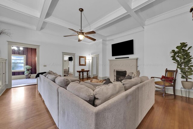 1600 Birmingham Ave, Jasper, AL 35501 - living area with a brick fireplace, coffered ceiling, wood finished floors, ceiling fan, and beam ceiling