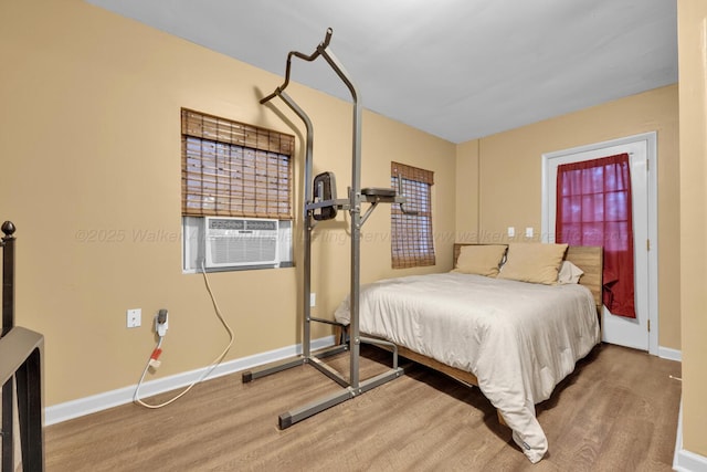 1600 Birmingham Ave, Jasper, AL 35501 - bedroom with cooling unit and wood finished floors