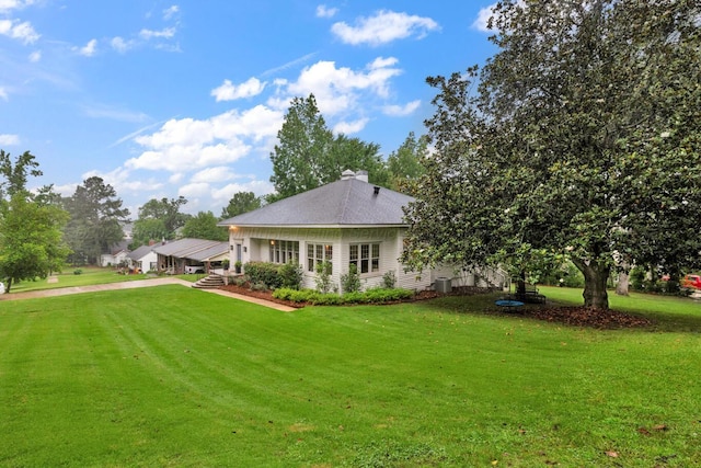 1600 Birmingham Ave, Jasper, AL 35501 - back of house featuring a lawn and a shingled roof