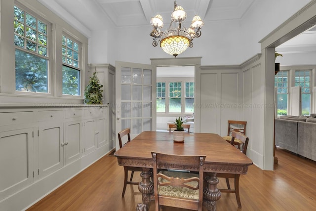 1600 Birmingham Ave, Jasper, AL 35501 - dining space with a decorative wall, light wood-style flooring, a chandelier, coffered ceiling, and beamed ceiling