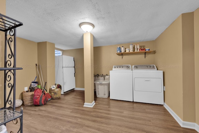 1600 Birmingham Ave, Jasper, AL 35501 - laundry area with washer and dryer, wood finished floors, and a textured ceiling