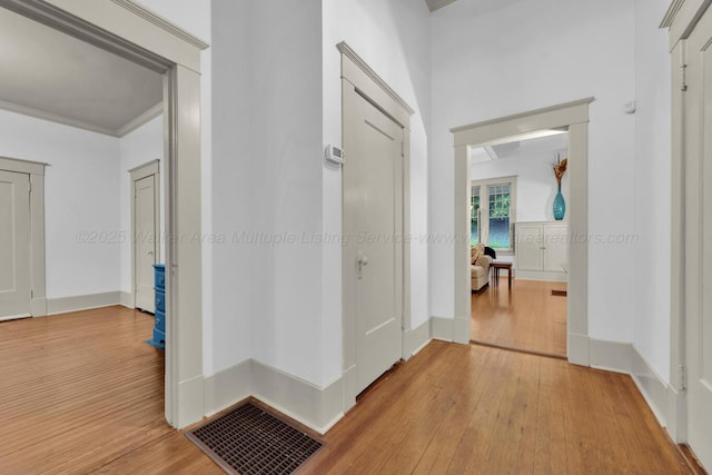1600 Birmingham Ave, Jasper, AL 35501 - hallway featuring light wood finished floors and crown molding