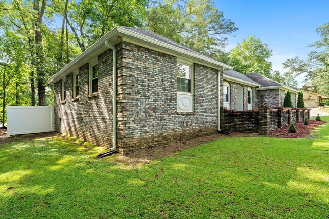 1812 N Walston Rd, Jasper, AL 35504 - view of side of home with a yard and brick siding
