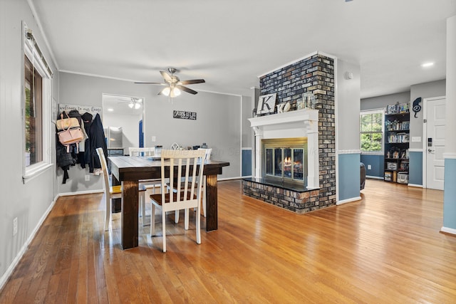 1812 N Walston Rd, Jasper, AL 35504 - dining space featuring a ceiling fan, wood finished floors, and a brick fireplace