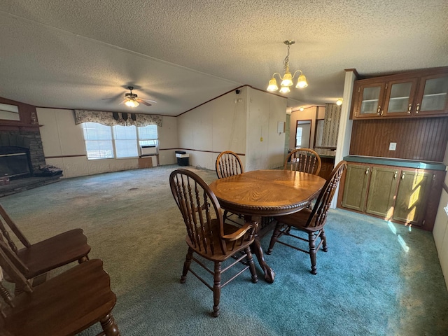 1139 Pumpkin Center Cut Off Rd, Quinton, AL 35130 - dining space featuring cooling unit, ceiling fan with notable chandelier, a textured ceiling, light carpet, and a fireplace