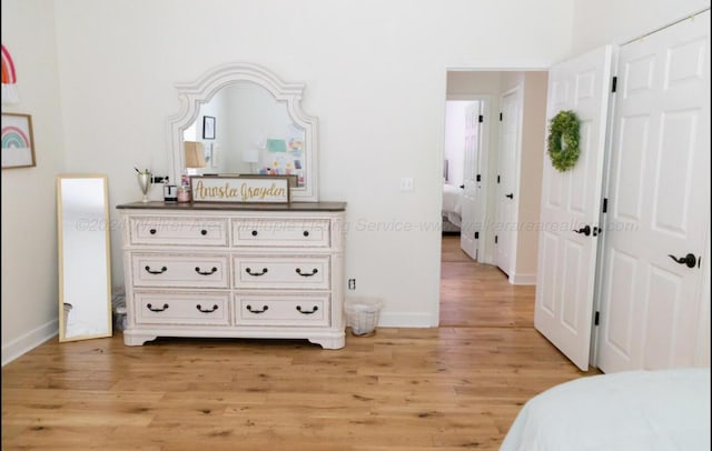 bedroom with light wood-type flooring