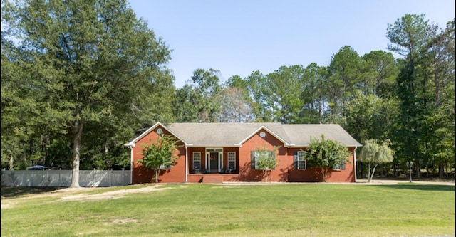 ranch-style house featuring a front yard