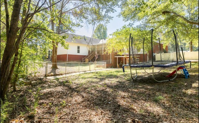 view of yard featuring a trampoline