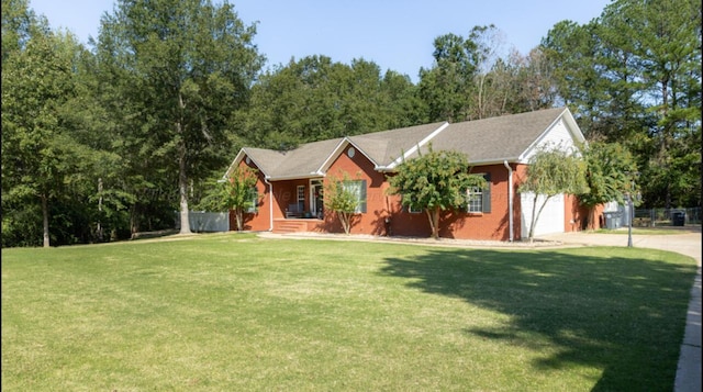 view of front of property with a garage and a front lawn