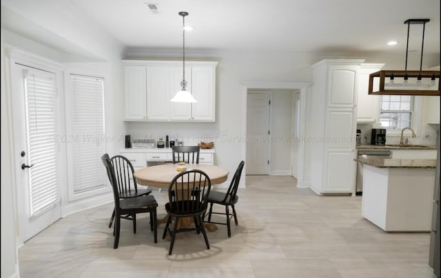 dining area featuring sink