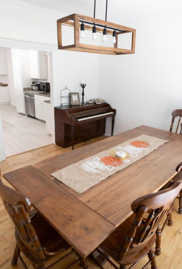 dining space featuring light hardwood / wood-style floors