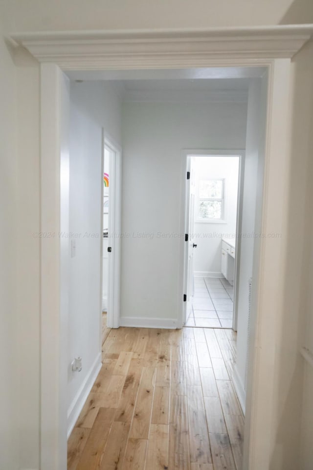 hall with light hardwood / wood-style floors