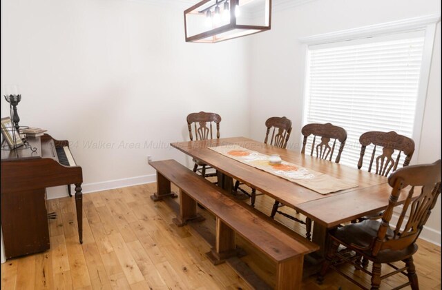 dining area with light wood-type flooring