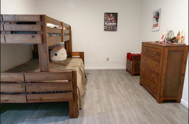 bedroom with light hardwood / wood-style flooring