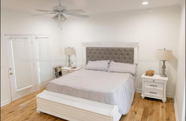 bedroom with ceiling fan and light hardwood / wood-style flooring