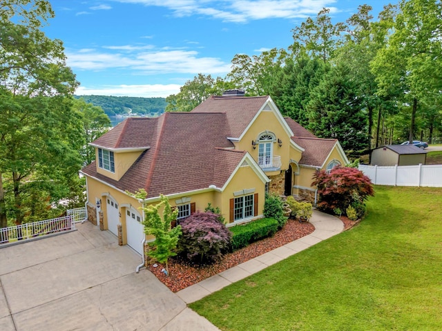 129 County Road 293, Cullman, AL 35057 - traditional home with stucco siding, driveway, stone siding, and a shingled roof