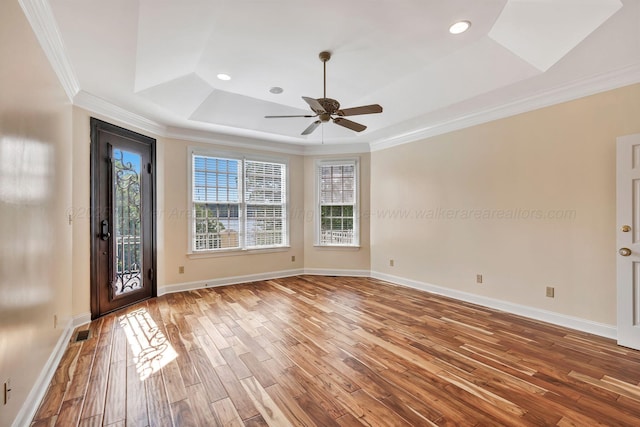 129 County Road 293, Cullman, AL 35057 - foyer entrance featuring a tray ceiling, wood finished floors, a ceiling fan, ornamental molding, and baseboards
