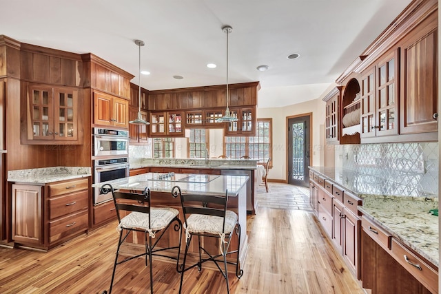 129 County Road 293, Cullman, AL 35057 - kitchen featuring stainless steel appliances, decorative backsplash, light wood-type flooring, and recessed lighting