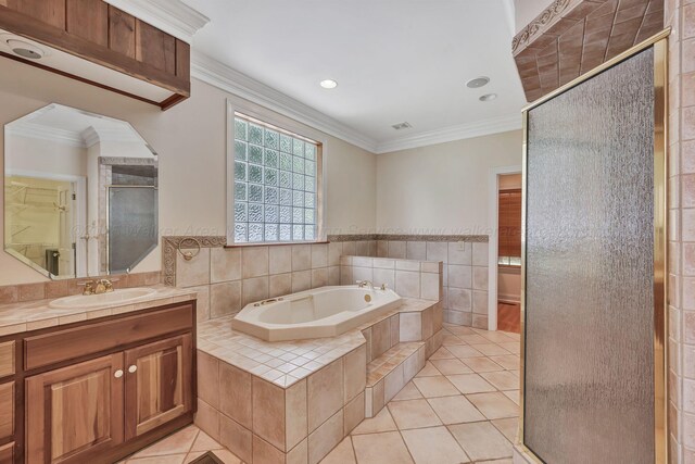 129 County Road 293, Cullman, AL 35057 - bathroom featuring a shower stall, tile patterned floors, a bath, crown molding, and vanity