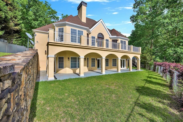 129 County Road 293, Cullman, AL 35057 - back of property with a balcony, stucco siding, a patio, and a chimney