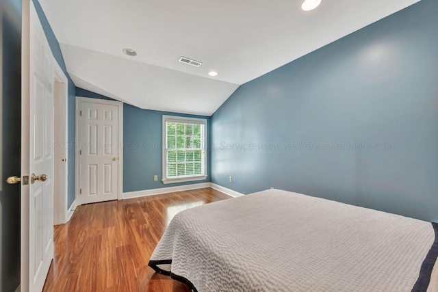 129 County Road 293, Cullman, AL 35057 - bedroom with vaulted ceiling, baseboards, wood finished floors, and recessed lighting