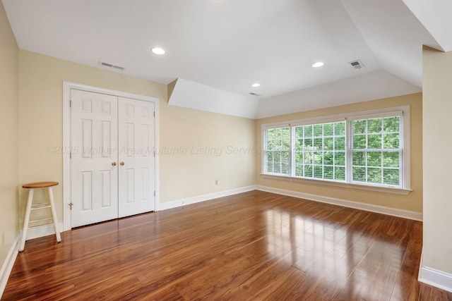 129 County Road 293, Cullman, AL 35057 - unfurnished bedroom with wood finished floors, baseboards, a closet, recessed lighting, and lofted ceiling