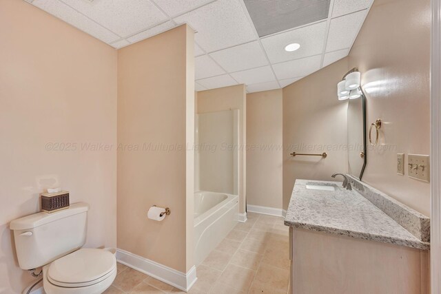 129 County Road 293, Cullman, AL 35057 - bathroom with baseboards, toilet, a drop ceiling, and tile patterned floors
