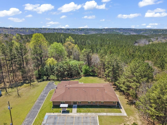 9670 Smith Lake Rd, Jasper, AL 35504 - aerial view of property and surrounding area with a heavily wooded area