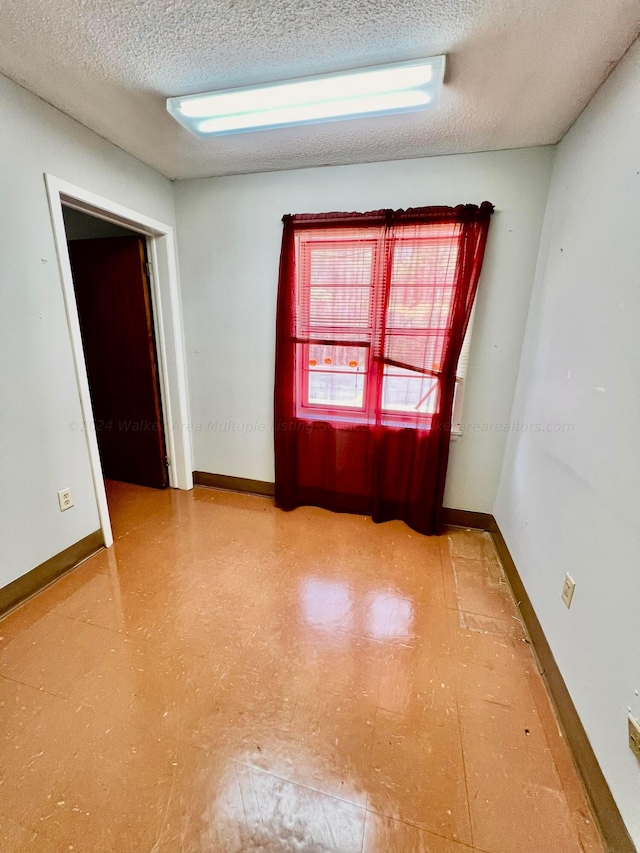 9670 Smith Lake Rd, Jasper, AL 35504 - empty room with tile patterned floors and a textured ceiling