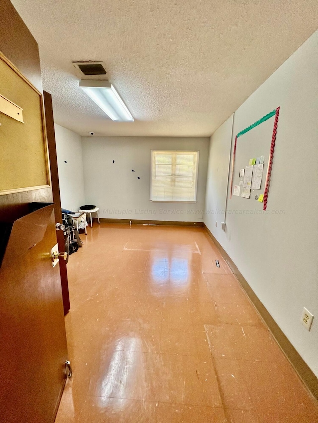 9670 Smith Lake Rd, Jasper, AL 35504 - unfurnished room featuring tile patterned floors and a textured ceiling