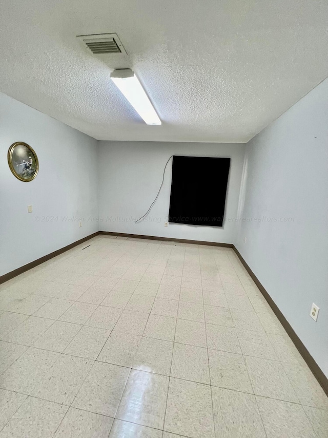 9670 Smith Lake Rd, Jasper, AL 35504 - unfurnished room featuring a textured ceiling and baseboards