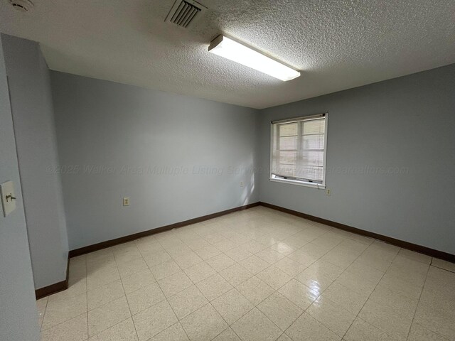9670 Smith Lake Rd, Jasper, AL 35504 - bathroom with a textured ceiling and tile patterned floors