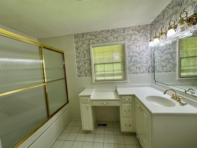 312 Crescent Cir, Jasper, AL 35503 - bathroom featuring wallpapered walls, tile patterned floors, a textured ceiling, vanity, and plenty of natural light