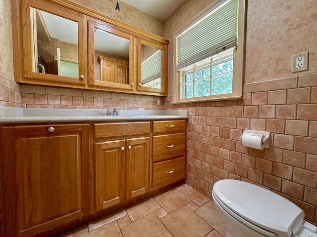 312 Crescent Cir, Jasper, AL 35503 - bathroom with tile walls and vanity
