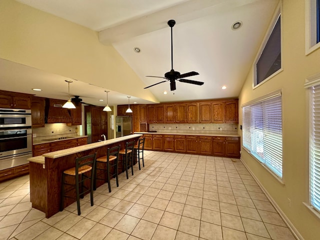 312 Crescent Cir, Jasper, AL 35503 - kitchen featuring ceiling fan, decorative backsplash, a warming drawer, light countertops, and beam ceiling