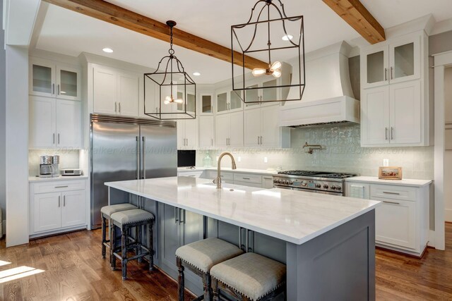 397 Blue Water Pointe Dr, Jasper, AL 35504 - kitchen with a chandelier, premium range hood, white cabinetry, a sink, and premium appliances